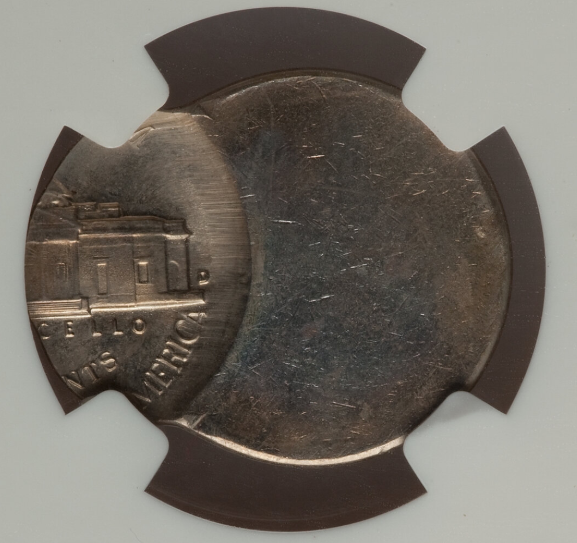 1952 nickel off-center strike error showing design shifted with a blank planchet crescent visible at the rim